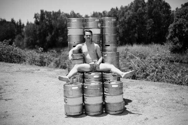Here's Josh Scully posing outside the Illawarra Brewing Company for the Men of Movember calendar. Hope they washed those kegs afterwards. Photo: Josh Haberfield