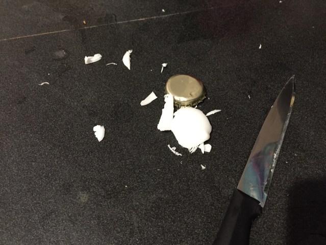 The crap left over after a good five minutes of trying to get a goddamn wax seal off a beer bottle.